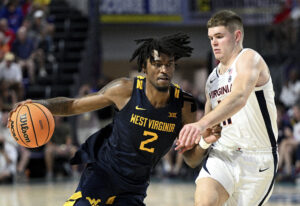 No. 24 Virginia makes clutch plays down the stretch to knock off WVU 56-54